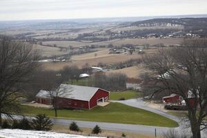 A red barn with a road in front of it photo