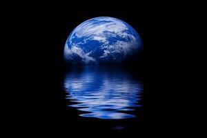 The earth is reflected in water on a black background photo