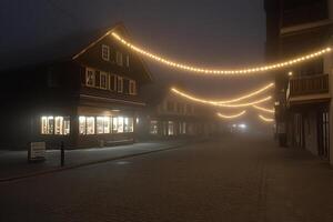 A street with a lighted store front and a street light photo