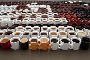 A large group of coffee cups arranged in a pattern photo