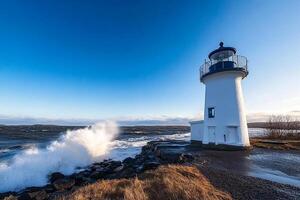 A lighthouse with waves crashing against it on a sunny day photo