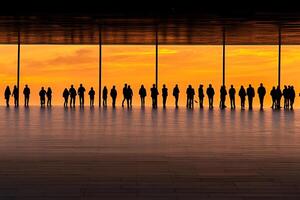 A group of people standing in front of a large window photo