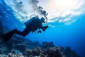 A scuba diver in the ocean with a sun shining photo