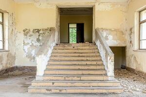 A stairway in an abandoned building photo