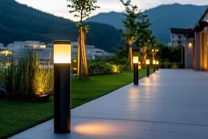 Modern garden lighting illuminating a pathway at dusk photo