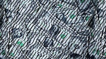 Patterns and textures created by overlapping dollar bills in a close-up view highlighting the intricate design during daylight video