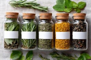 Dried herbs and spices preserved in glass jars with blank labels for customization photo