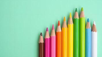 Pastel Colored Pencils with Increasing Sizes on Top Edge photo