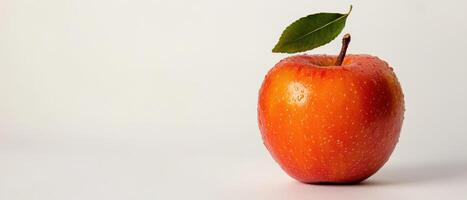 Fresh red apple with leaf on white background photo
