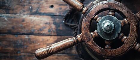 Old wooden ship wheel on a rustic surface photo