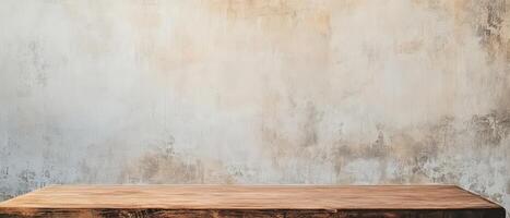 An empty wooden table in front of a wall photo