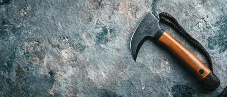 Crafting tool resting on textured stone surface photo