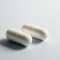 White capsules on a smooth surface during daytime photo
