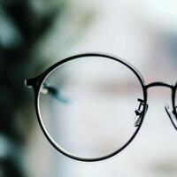Close up of round glasses in blur photo