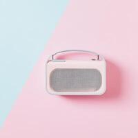 Minimalistic radio on pastel colored background photo