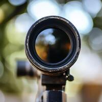 Close up of a rifle scope during daylight hours photo