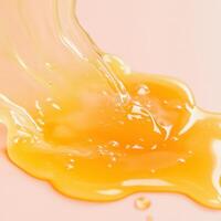 Liquid gold drips and pools on a smooth surface photo