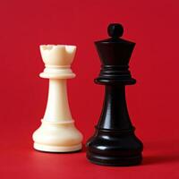 Chess pieces on a vibrant red background display photo