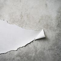 Torn paper revealing smooth surface underneath photo