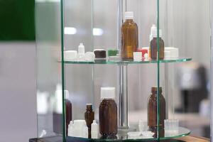 Various bottles for eye drops and medications on a stand. Industry photo