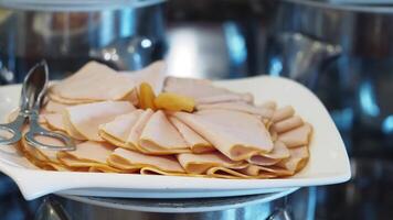 Delicious cold cuts arranged on a platter at a buffet video