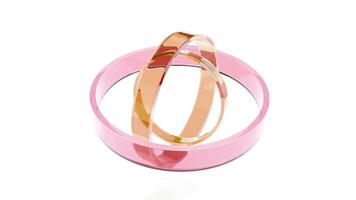 A pink and gold ring sitting in a circular shape video