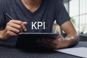 Analyzing Key Performance Indicators on Digital Tablet for Business Insights photo