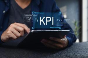 Analyzing Key Performance Indicators on a Tablet Device photo