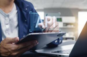 Programmer Working on API Interface Development with Tablet and Laptop photo