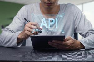 Professional Programmer Working on API Development with Tablet photo