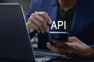 Close-Up of Interface Programming with Smartphone and Laptop Display photo