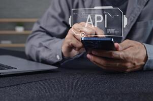 Hands Using Smartphone with API Interface Illustration on Screen photo