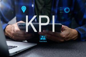 Hands Holding Smartphone Overlaid with KPI and Performance Indicators photo
