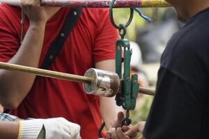 Several people are conducting a weighing operation to ensure accurate measurements photo