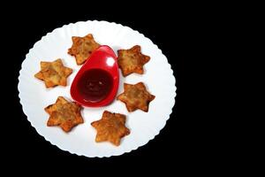 Golden, Buttery Starry Aloo Puff Pastries with Tangy Tomato Dip - A Delightful Indian Appetizer for All Celebrations photo