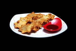 Golden Aloo Puff Pastries with Tangy Tomato Sauce - A Perfectly Flaky Treat for Tea-Time and Parties photo