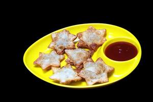 Crisp and Buttery Star Aloo Puffs with Savory Tomato Sauce on Black Marble - The Ultimate Snack for Special Occasions photo