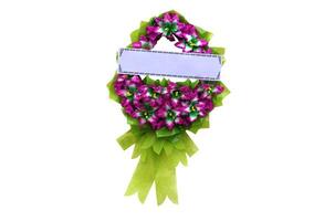 Flower wreath with paper card for adding text, isolated on white background. Concept, Wreaths for paying respect to the deceased in Thai culture at funerals. photo