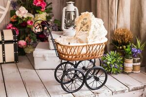 Doll's pram. Vintage doll stroller. Retro cart dolls photo