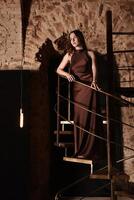 An Elegant Fashion Pose Captured in a Rustic Space with Great Artistic Flair and Style photo