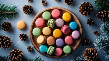 Colorful Macarons on Wooden Plate with Pine Cones and Fir Branches photo