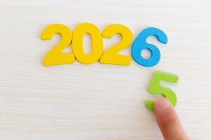Colorful Wooden Numbers 2026 on Light Wooden Background photo