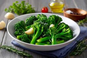 Steamed broccoli with garlic and olive oil dressing sitting on rustic wooden table photo