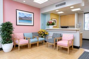 Modern medical clinic waiting room with colorful armchairs and reception desk photo