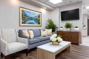 Modern waiting room with comfortable furniture and nature photography photo