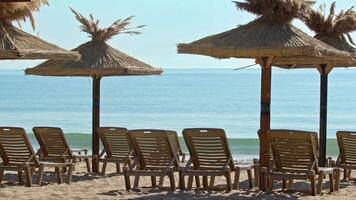 Empty Wooden Umbrella on Ocean Beach in Early Morning in Summer Footage. video