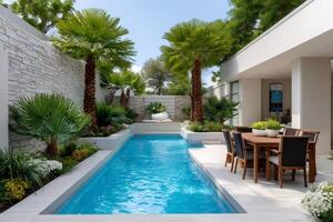 Modern lap pool surrounded by palm trees and lush vegetation photo