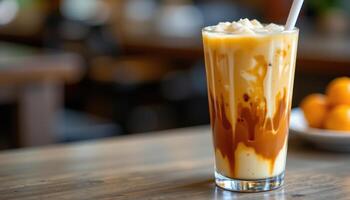 a cup of creamy thai iced tea with milk layers. photo