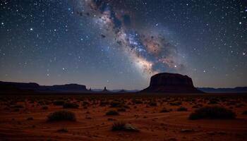 a starlit desert with distant mesas. photo
