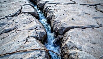 glacial meltwater cascading through granite cracks. photo